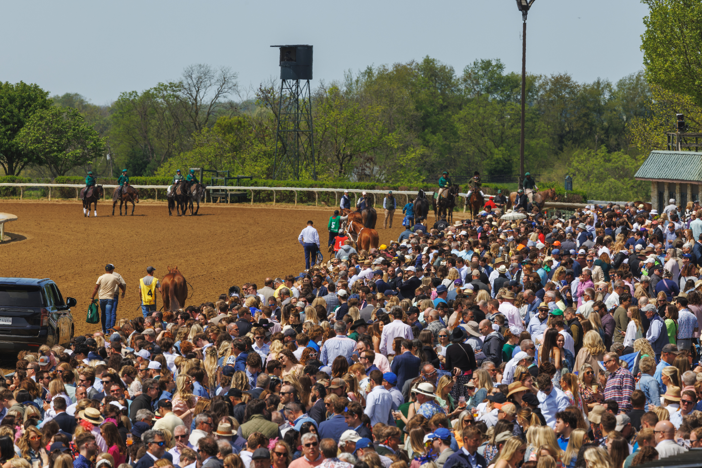 crowd watching racing on the track apron