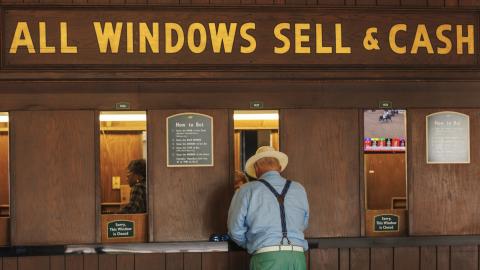 man at wagering window